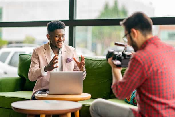 Vlogger with cameramen