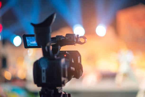 The video camera is broadcast live on stage.